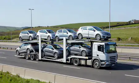 Multi-level car carrier on the motorway to Torquay, Devon, United Kingdom