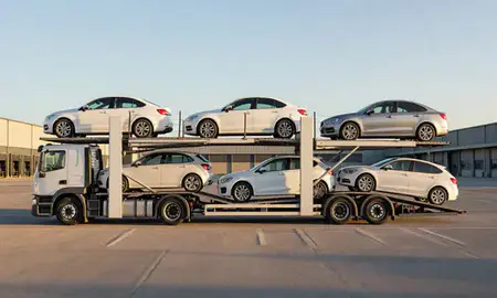Car transporter parked in an industrial area of Torquay, Devon, United Kingdom