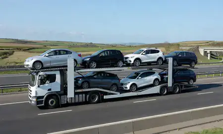 Multi-level car carrier on the motorway to Dorset, United Kingdom