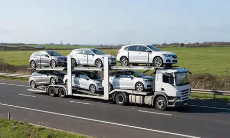 Multi-level car carrier on the motorway to Christchurch, Dorset, United Kingdom