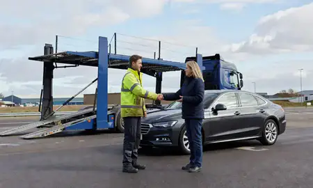 Vehicle owner beside their delivered car in Dundee, United Kingdom