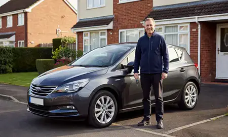 Car delivered to a driveway in Llanelli, Dyfed, United Kingdom
