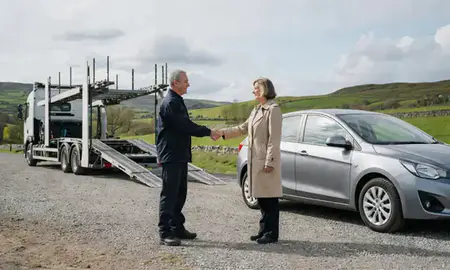 Vehicle owner beside their delivered car in East Ayrshire, United Kingdom
