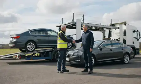 Vehicle owner beside their delivered car in Kilmarnock, East Ayrshire, United Kingdom