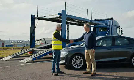 Vehicle owner beside their delivered car in Kingston upon Hull, East Riding of Yorkshire, United Kingdom