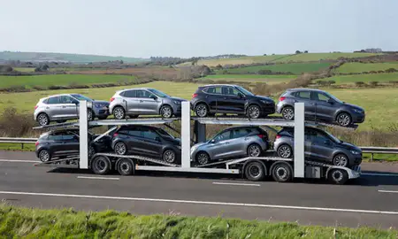 Multi-level car carrier on the motorway to East Sussex, United Kingdom