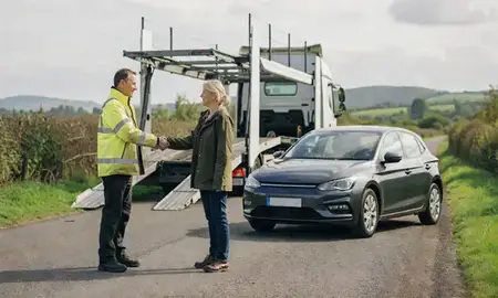 Vehicle owner beside their delivered car in East Sussex, United Kingdom