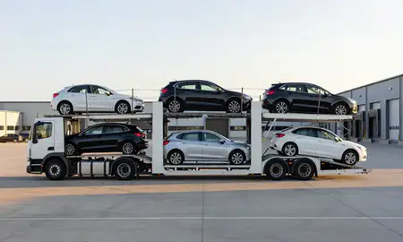 Car transporter parked in an industrial area of East Sussex, United Kingdom