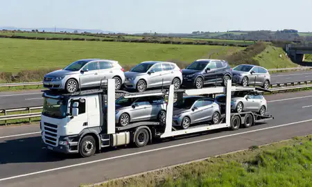 Multi-level car carrier on the motorway to Eastbourne, East Sussex, United Kingdom