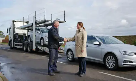 Vehicle owner beside their delivered car in Essex, United Kingdom