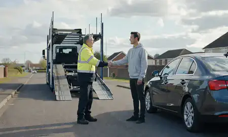 Vehicle owner beside their delivered car in Basildon, Essex, United Kingdom