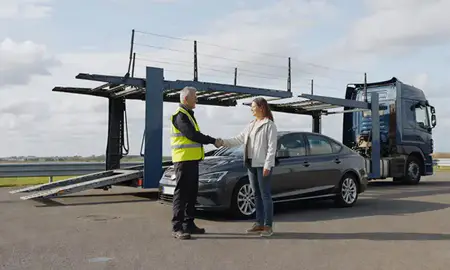 Vehicle owner beside their delivered car in Braintree, Essex, United Kingdom