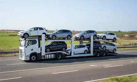 Multi-level car carrier on the motorway to Brentwood, Essex, United Kingdom