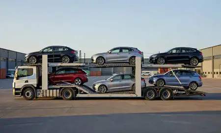 Car transporter parked in an industrial area of Canvey Island, Essex, United Kingdom
