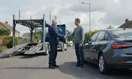 Vehicle owner beside their delivered car in Chelmsford, Essex, United Kingdom