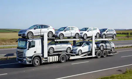 Multi-level car carrier on the motorway to Clacton-on-Sea, Essex, United Kingdom