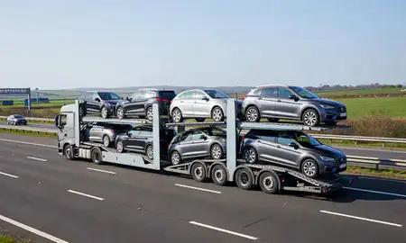 Multi-level car carrier on the motorway to Colchester, Essex, United Kingdom