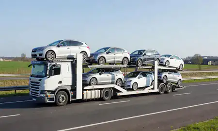 Multi-level car carrier on the motorway to Harlow, Essex, United Kingdom
