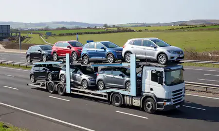 Multi-level car carrier on the motorway to Glenrothes, Fife, United Kingdom
