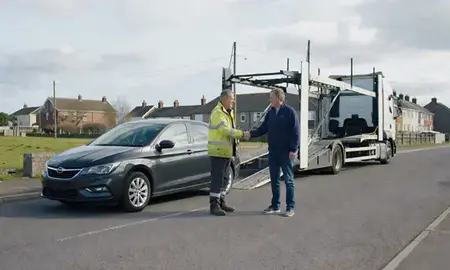 Vehicle owner beside their delivered car in Kirkcaldy, Fife, United Kingdom