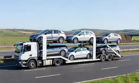 Multi-level car carrier on the motorway to Gloucestershire, United Kingdom