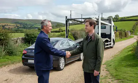 Vehicle owner beside their delivered car in Gloucestershire, United Kingdom
