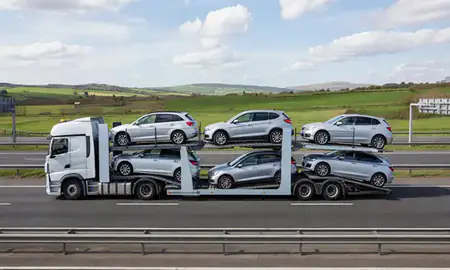 Multi-level car carrier on the motorway to Cheltenham, Gloucestershire, United Kingdom