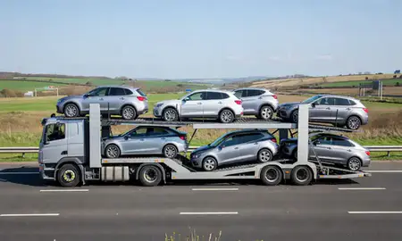 Multi-level car carrier on the motorway to Gloucester, Gloucestershire, United Kingdom