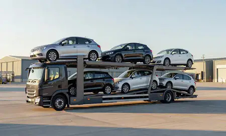 Car transporter loaded with vehicles in Gloucester, Gloucestershire, United Kingdom