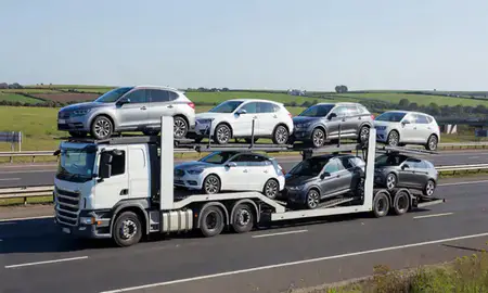 Multi-level car carrier on the motorway to Greater Manchester, United Kingdom