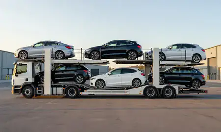 Car transporter parked in an industrial area of Altrincham, Greater Manchester, United Kingdom