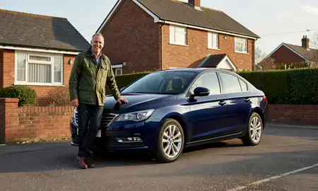 Customer with their delivered car in Ashton-under-Lyne, Greater Manchester, United Kingdom