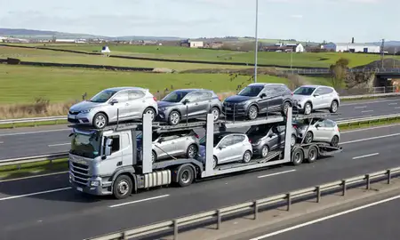 Multi-level car carrier on the motorway to Atherton, Greater Manchester, United Kingdom