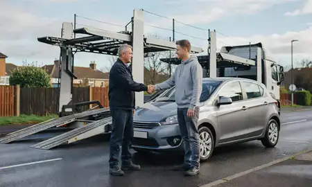 Vehicle owner beside their delivered car in Bury, Greater Manchester, United Kingdom