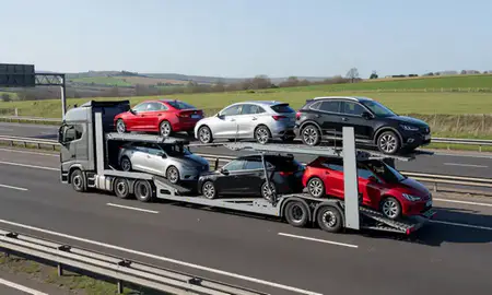Multi-level car carrier on the motorway to Chadderton, Greater Manchester, United Kingdom