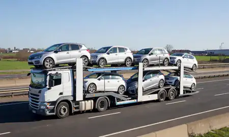 Multi-level car carrier on the motorway to Denton, Greater Manchester, United Kingdom