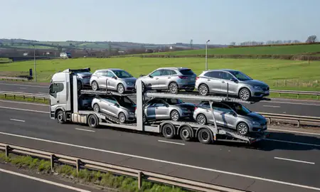 Multi-level car carrier on the motorway to Manchester, Greater Manchester, United Kingdom