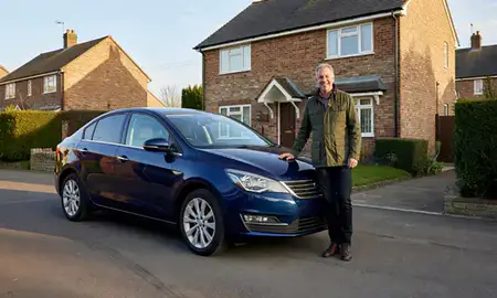 Customer with their delivered car in Oldham, Greater Manchester, United Kingdom