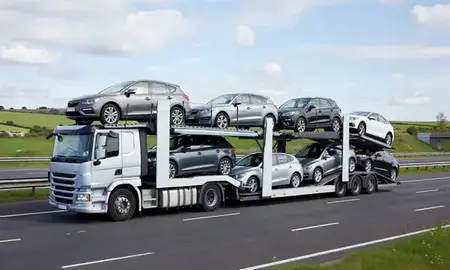 Multi-level car carrier on the motorway to Rochdale, Greater Manchester, United Kingdom