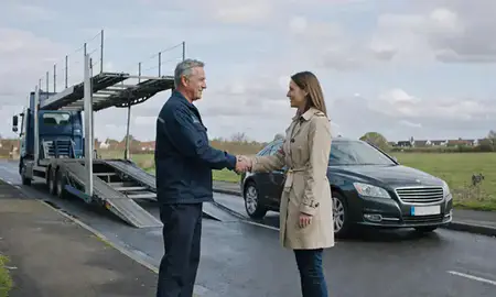 Vehicle owner beside their delivered car in Sale, Greater Manchester, United Kingdom