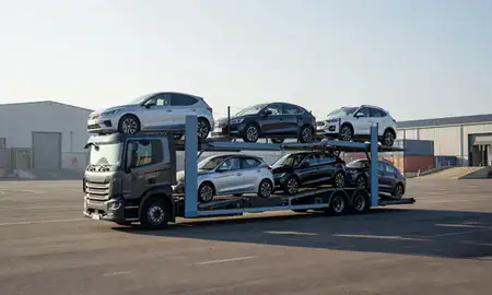 Car transporter loaded with vehicles in Sale, Greater Manchester, United Kingdom