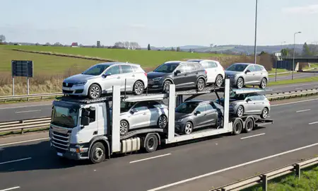 Multi-level car carrier on the motorway to Salford, Greater Manchester, United Kingdom