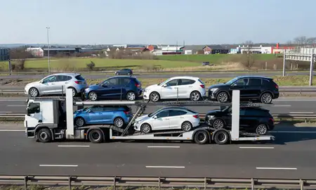 Multi-level car carrier on the motorway to Urmston, Greater Manchester, United Kingdom