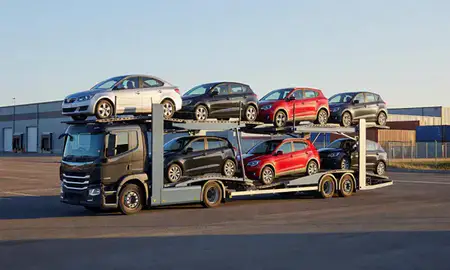 Car transporter loaded with vehicles in Urmston, Greater Manchester, United Kingdom