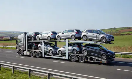 Multi-level car carrier on the motorway to Cwmbrân, Gwent, United Kingdom