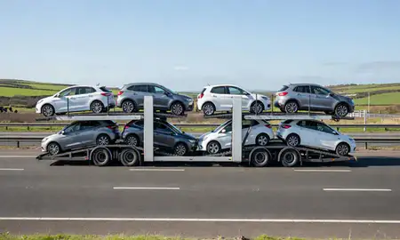 Multi-level car carrier on the motorway to Newport, Gwent, United Kingdom