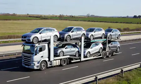 Multi-level car carrier on the motorway to Hampshire, United Kingdom