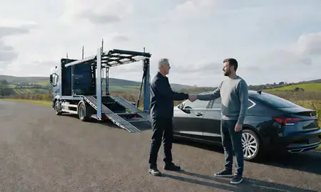 Vehicle owner beside their delivered car in Hampshire, United Kingdom