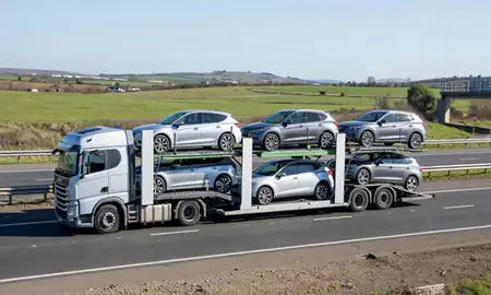Multi-level car carrier on the motorway to Andover, Hampshire, United Kingdom