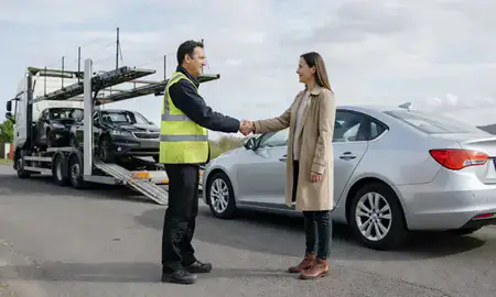 Vehicle owner beside their delivered car in Andover, Hampshire, United Kingdom